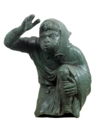 Romersk kunst: bronsestatuett av en knelende svart slave som blåser. 2. eller 3. århundre e.Kr. Paris, Louvre-museet