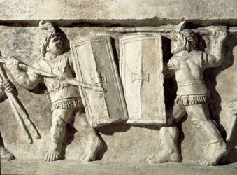 Romersk kunst: lavt relieff som representerer en kamp med gladiatorer. 1. århundre e.Kr. Roma, Museo della Civilta Romana