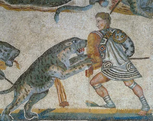 Mosaikk som viser en scene av en villdyrjakt, detalj av en gladiator som dreper et vilt dyr