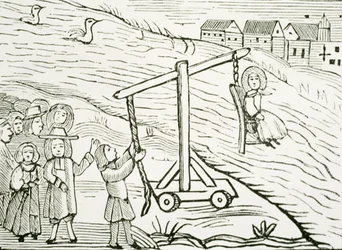 Kvinne på en dukkekrakk, anklaget for hekseri, illustrasjon fra en samling kapittelbøker om esoterikk (tresnitt)