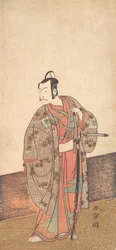 Skuespilleren Ichikawa Danjuro V står inne i et hus og foran en engawa, ca. 1772.