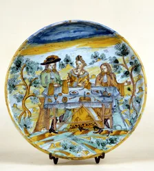 Representasjon av en utendørs bankett på en keramisk plate av Talavera de la rejna (Spania). Tidlig på 1500-tallet. Milano, Museo del Castello.