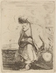 En gammel tyrker med turban på en stein