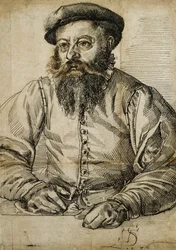 Portrett av en skjeggete mann, halv lengde, sittende ved et bord,