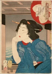 Kjølig: En geisha fra midten av 1870-årene sittende i en båt