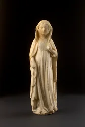 Figur av en stående kvinne