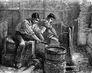 Kverner i arbeid på et hjul, c1880