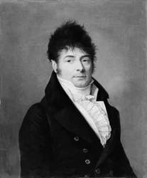 Portrett av en mann i en blå frakk.