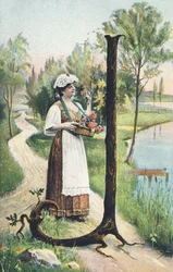 J: En stående kvinne i et langt skjørt, forkle og bodice bærer en kurv med blomster. Landsdekor - Alfabettegn Ref Th. E., L. Theochrom - Serie 994. Theodor Eisman, forlegger, Leipzig