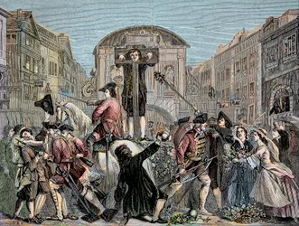 Daniel Defoe (De Foe) (1659-1731) ble pillet i London i 1703 for å ha publisert sin ironiske traktat "" The Shortest Way With the Dissenters""" - Forfatteren og eventyreren Daniel Defoe (1659-1731) dømte i 1703 til søylen. for hans manus mot int
