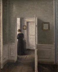 Interiør med en kvinne stående (olje på lerret)